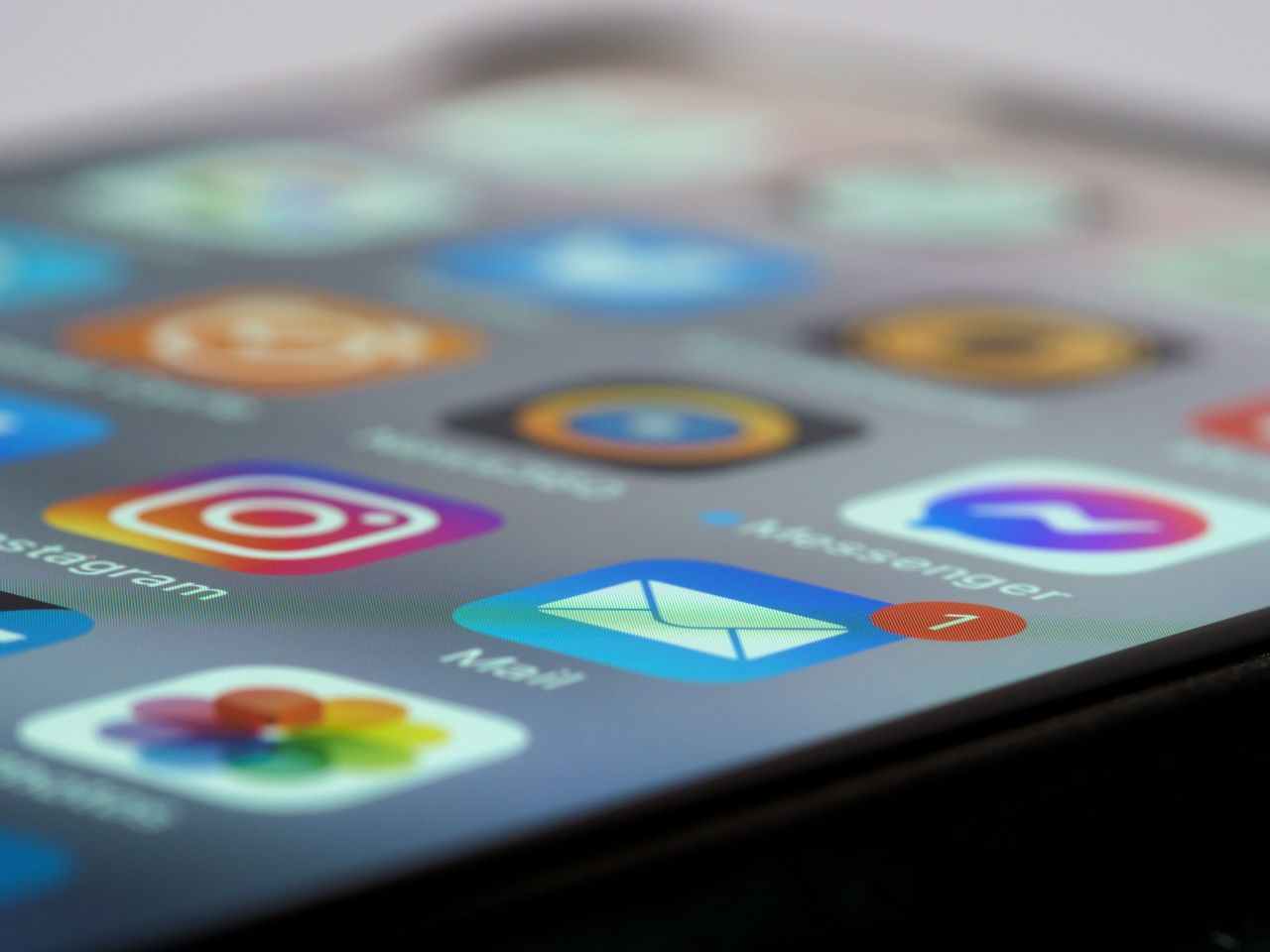 Phone screen showing messaging and photo sharing apps
